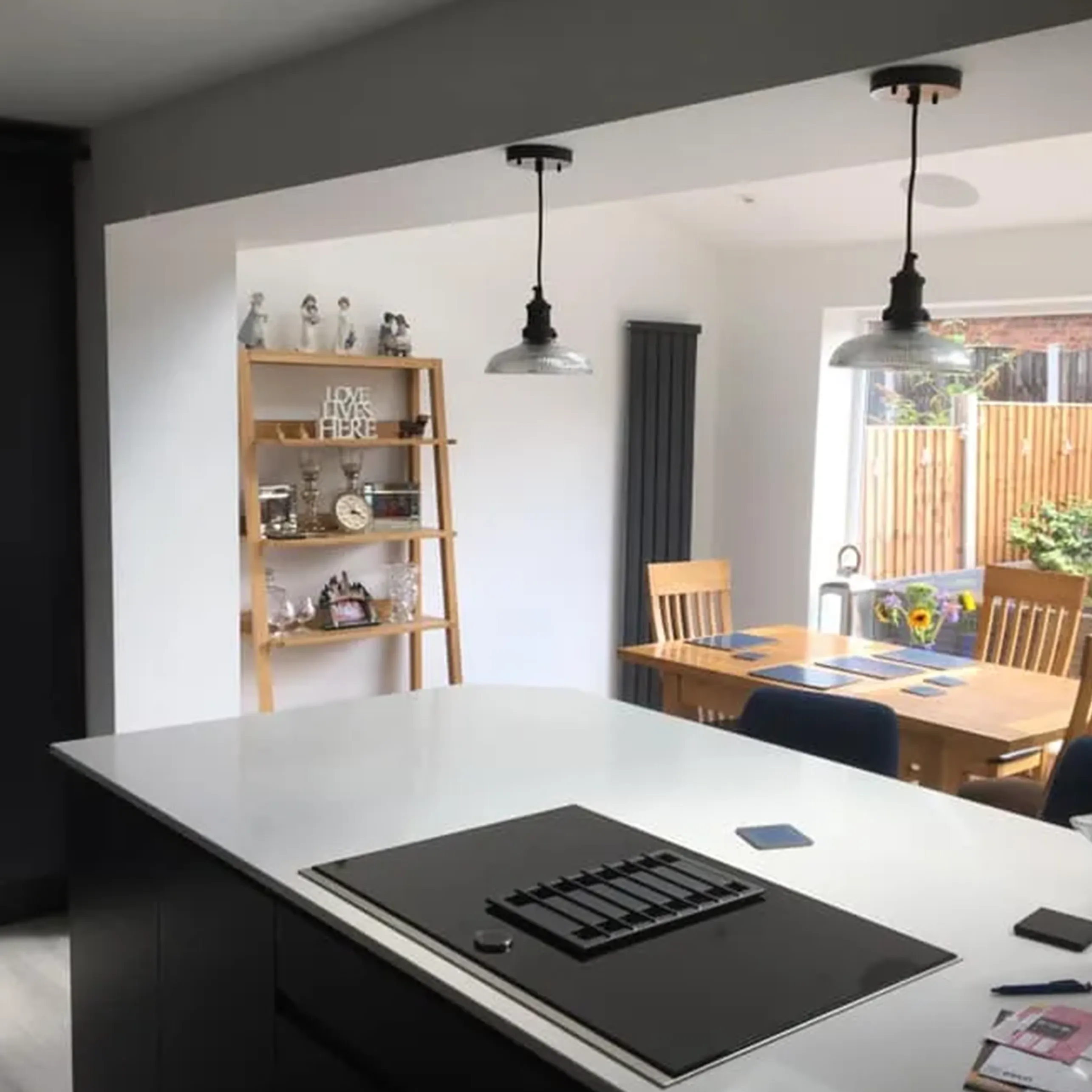 A kitchen with a stove top oven sitting inside of it.