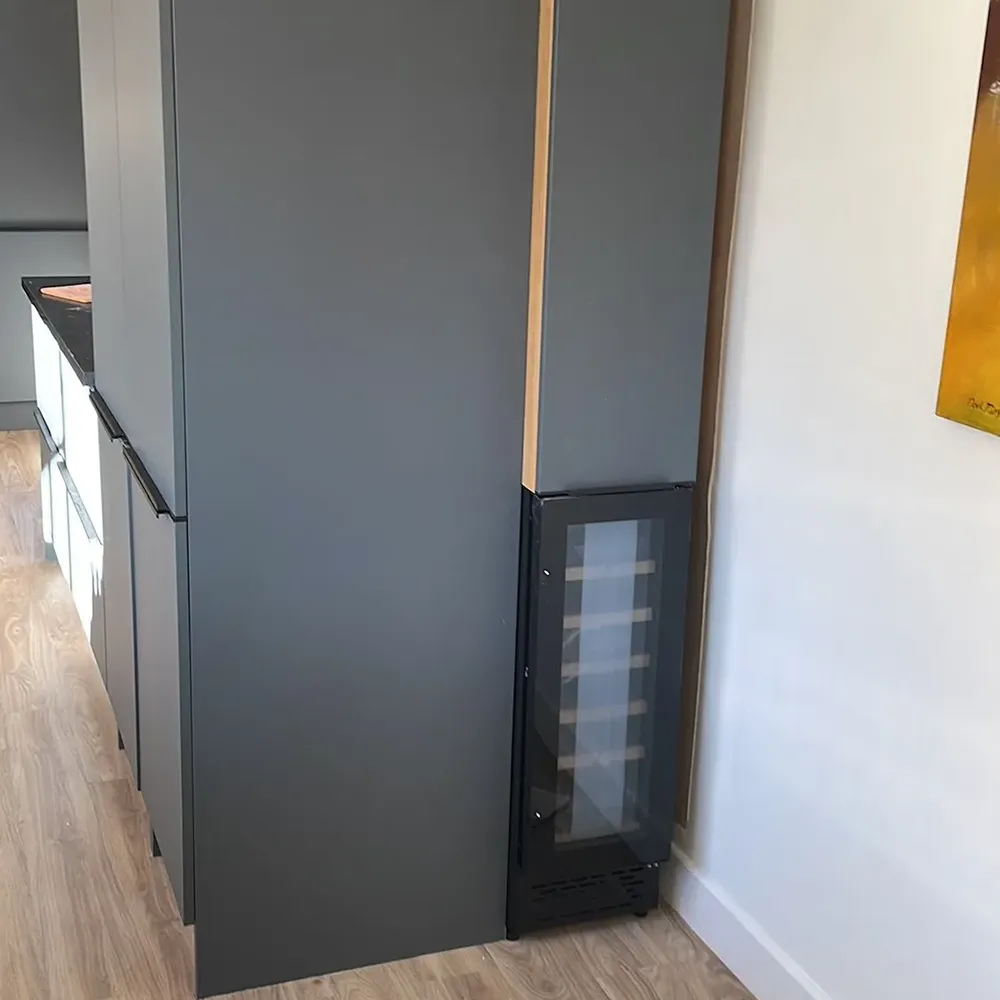 a refrigerator with a glass door in a kitchen