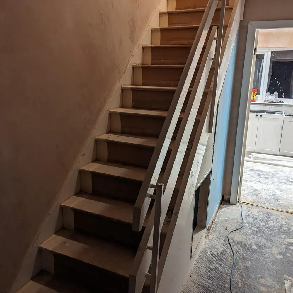 a set of stairs leading up to a kitchen