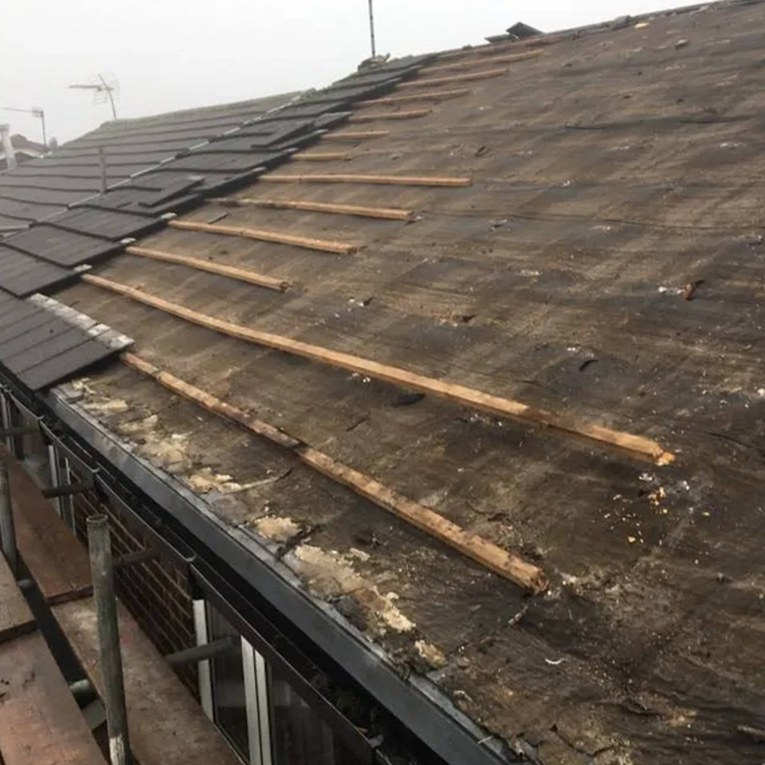 A roof that has been gutted with wood.