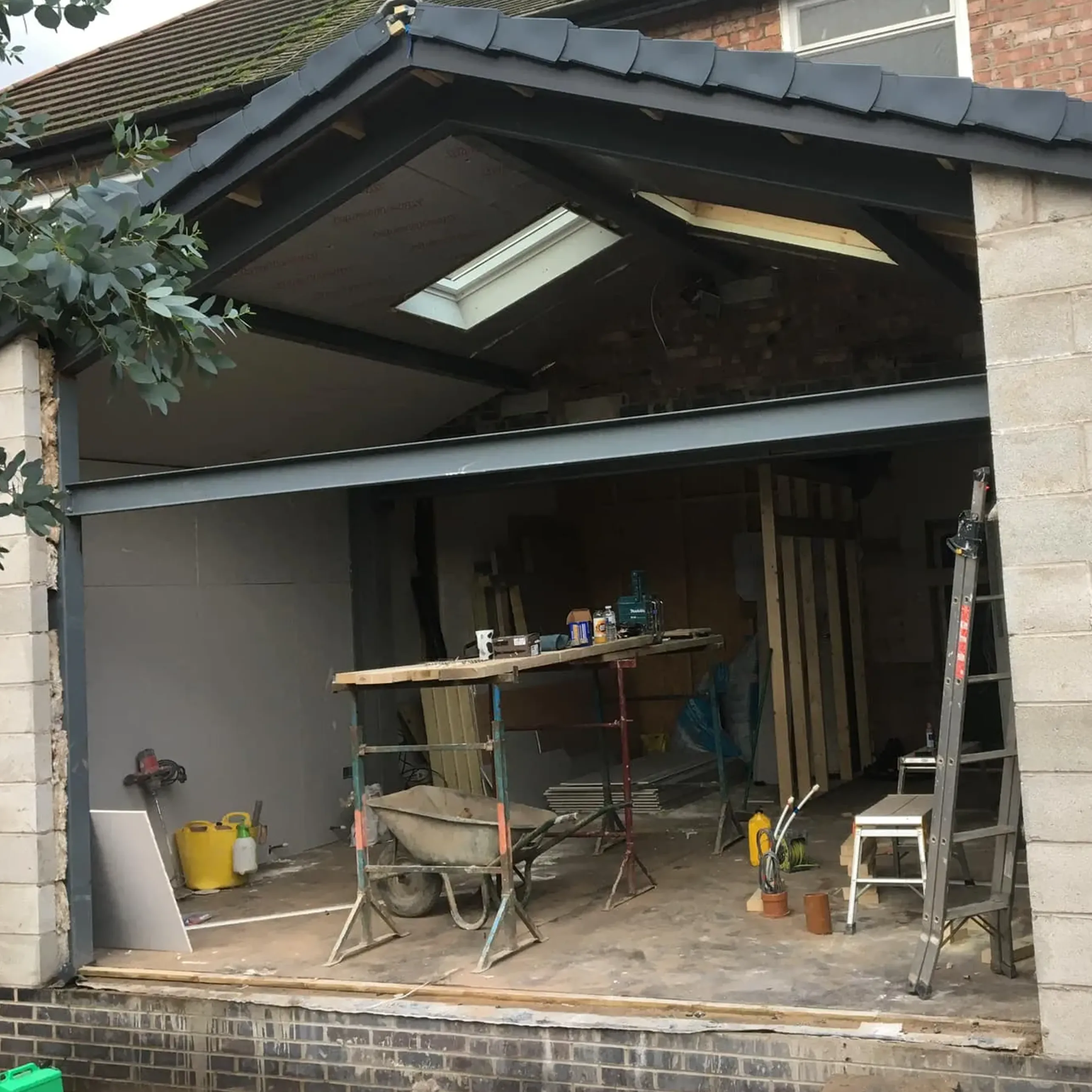 A garage with a table and chairs in it.